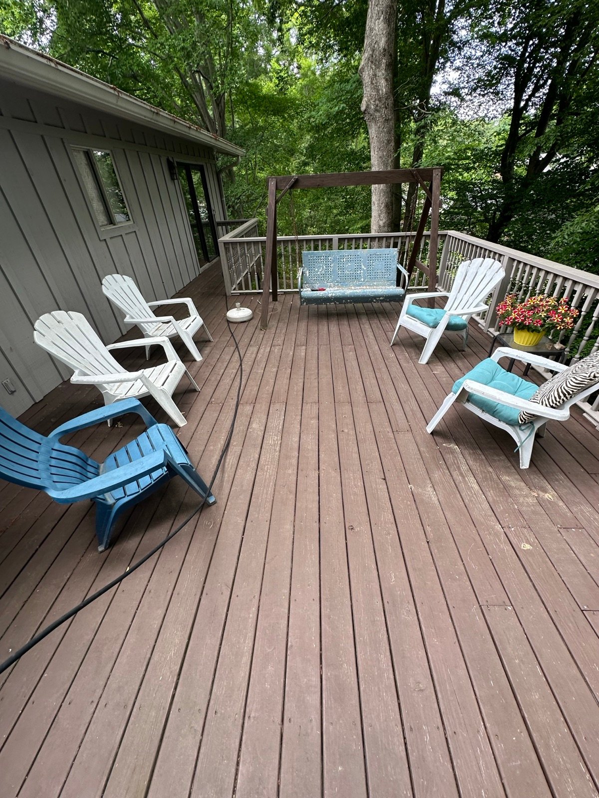 Wood deck before cleaning, faded and weathered gray
