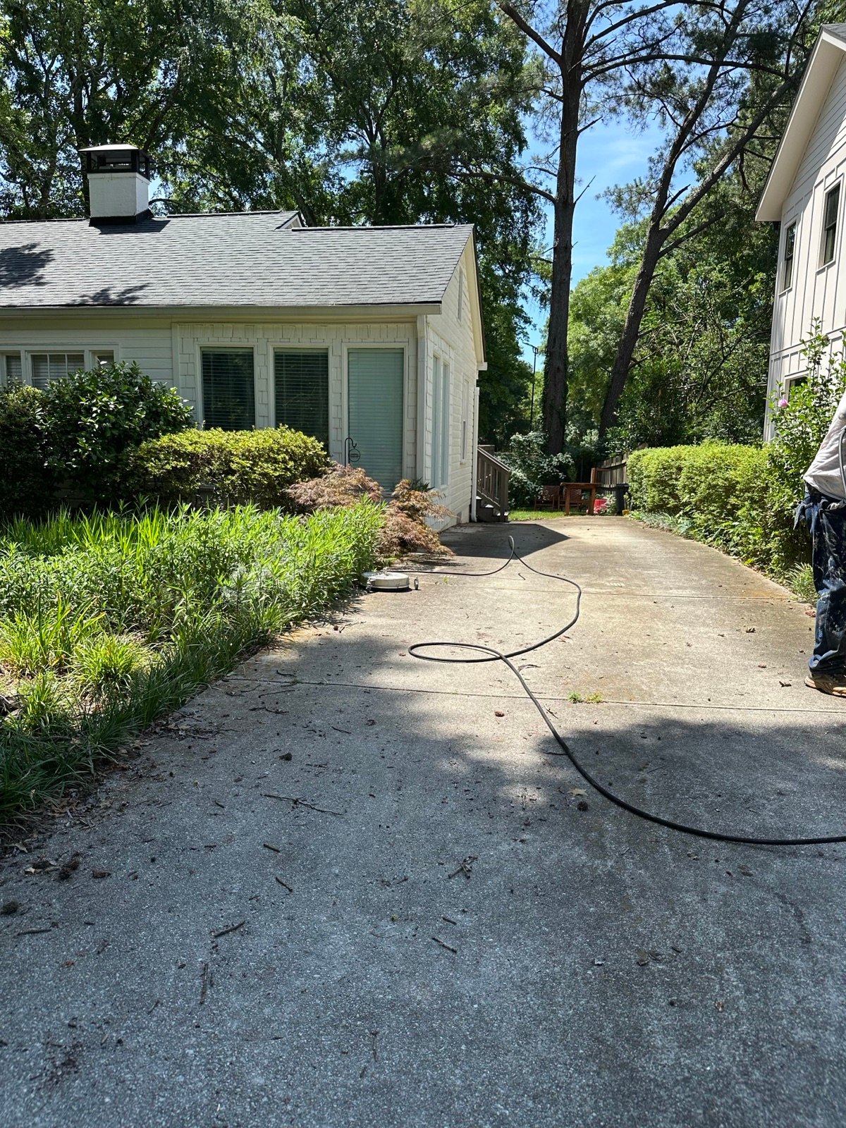 Driveway before cleaning, dark with built-up grime