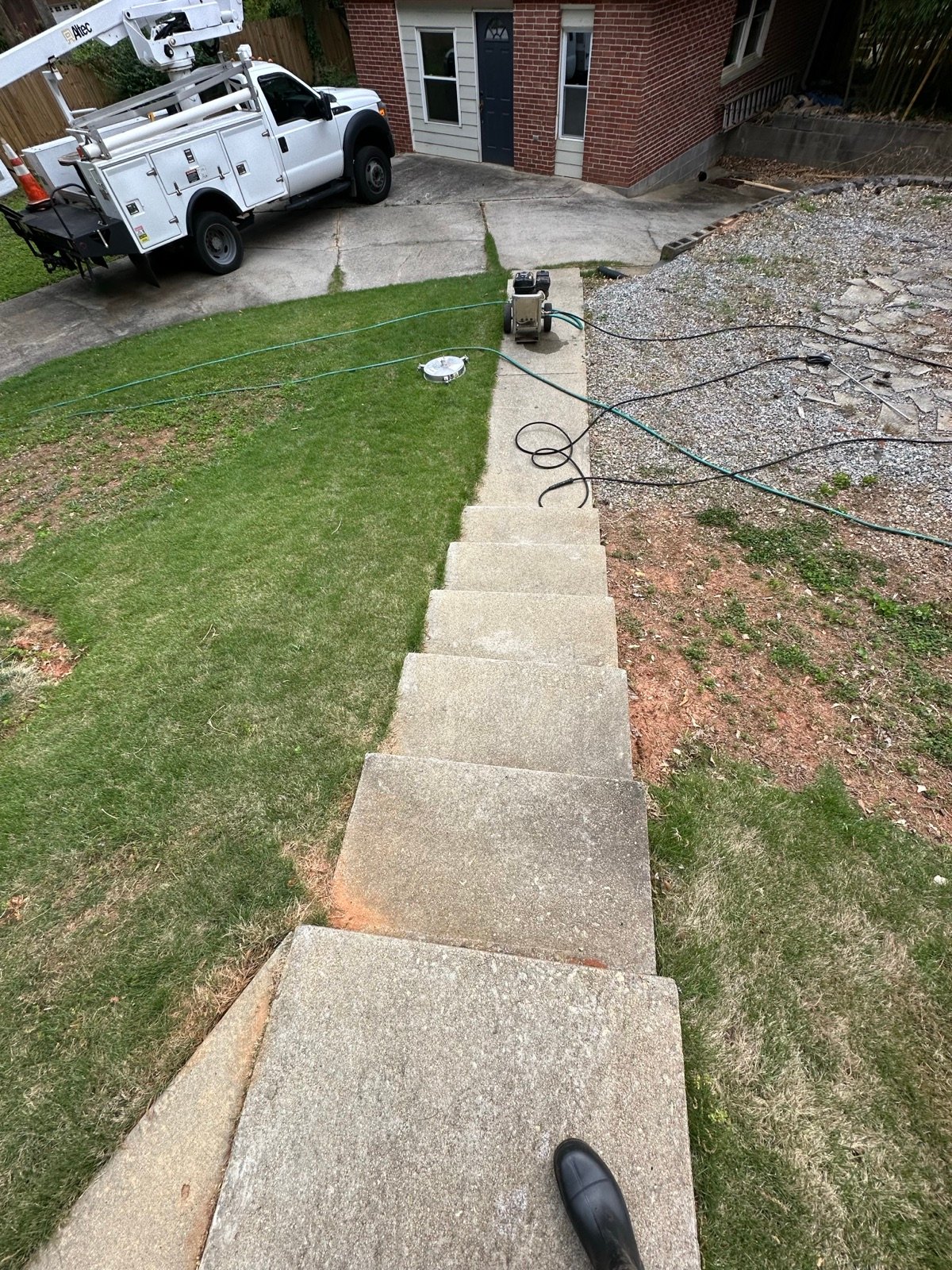 Stepping stone path before cleaning, dingy and discolored