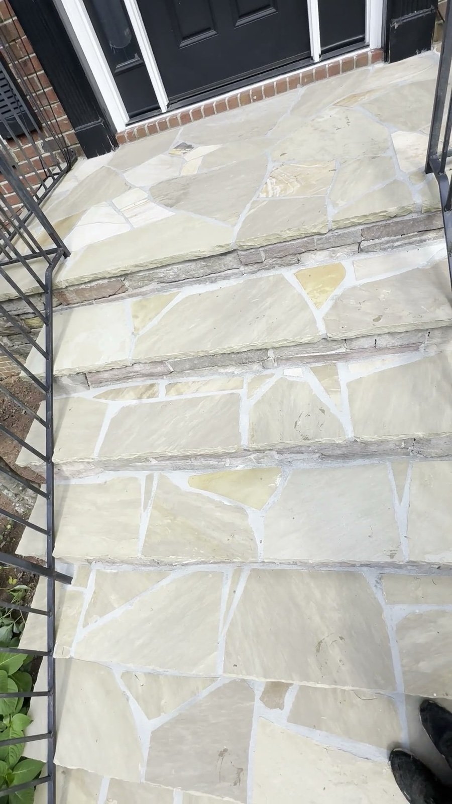 Flagstone entry steps after pressure washing, clean and restored
